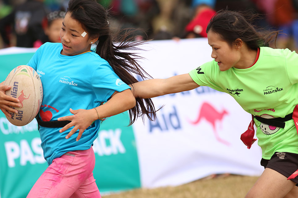 Girls in Vietnam playing tag rugby